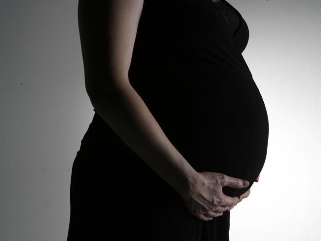 Generic photo of a woman 8 months pregnant.