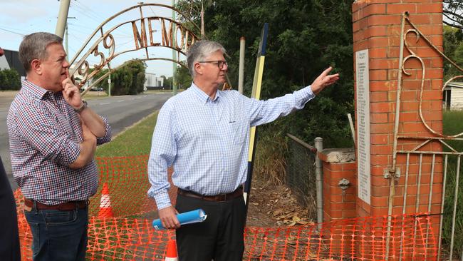 Member for Clayfield Tim Nicholls (left) and Cr David McLachlan (Hamilton Ward) inspect damage to the gates at the entrance to the former Pinkenba State School.