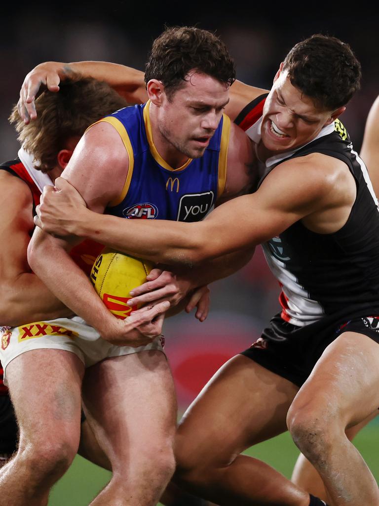 Marcus Windhager brings Lachie Neale to a halt. Picture: Michael Klein