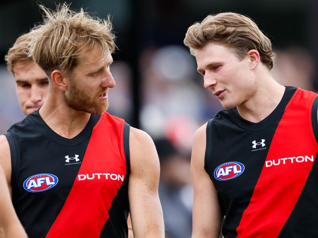 MELBOURNE, AUSTRALIA - FEBRUARY 23: Dyson Heppell of the Bombers chats \with Xavier Duursma of the Bombers during the AFL 2024 Match Simulation between the St Kilda Saints and Essendon Bombers at RSEA Park on February 23, 2024 in Melbourne, Australia. (Photo by Dylan Burns/AFL Photos via Getty Images)