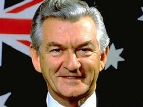 Bob Hawke poses in front of the Australian flag. Picture: Supplied