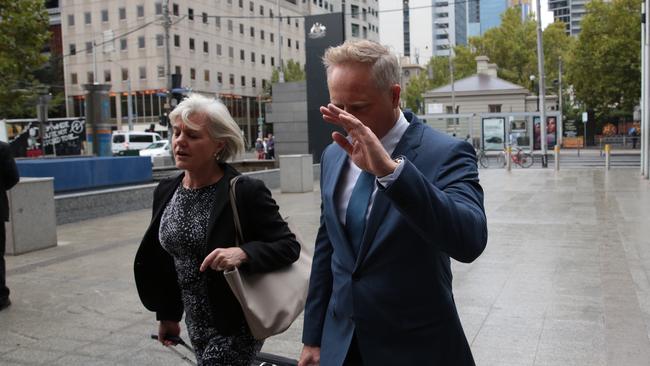 CEO and senior financial adviser at Henderson Maxwell Sam Henderson (right) arrives at the Federal Court in Melbourne. (AAP/Stefan Postles)