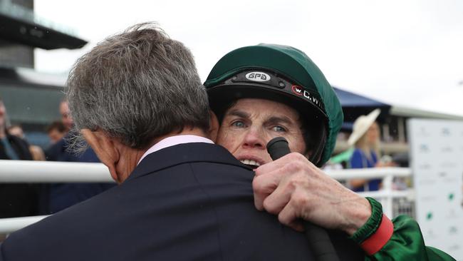 Jockey Craig Williams embraces Far Too Easy’s trainer David McColm. Picture: Jeremy Ng / Getty Images