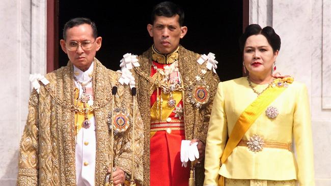 Thai King Bhumibol Adulyadej, Crown Prince Maha Vajiralongkorn and Queen Sirikit appearing at a balcony of Anantasamakom Throne Hall in Bangkok to mark the King's birthday in 1999. Picture: Pornchai Kittiwongsakul