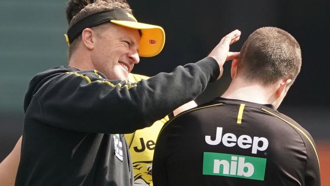 Damien Hardwick, coach of the Tigers inspects the scar on the head of Jack Higgins when the forward returned to training in September 2019. Picture: AAP Image