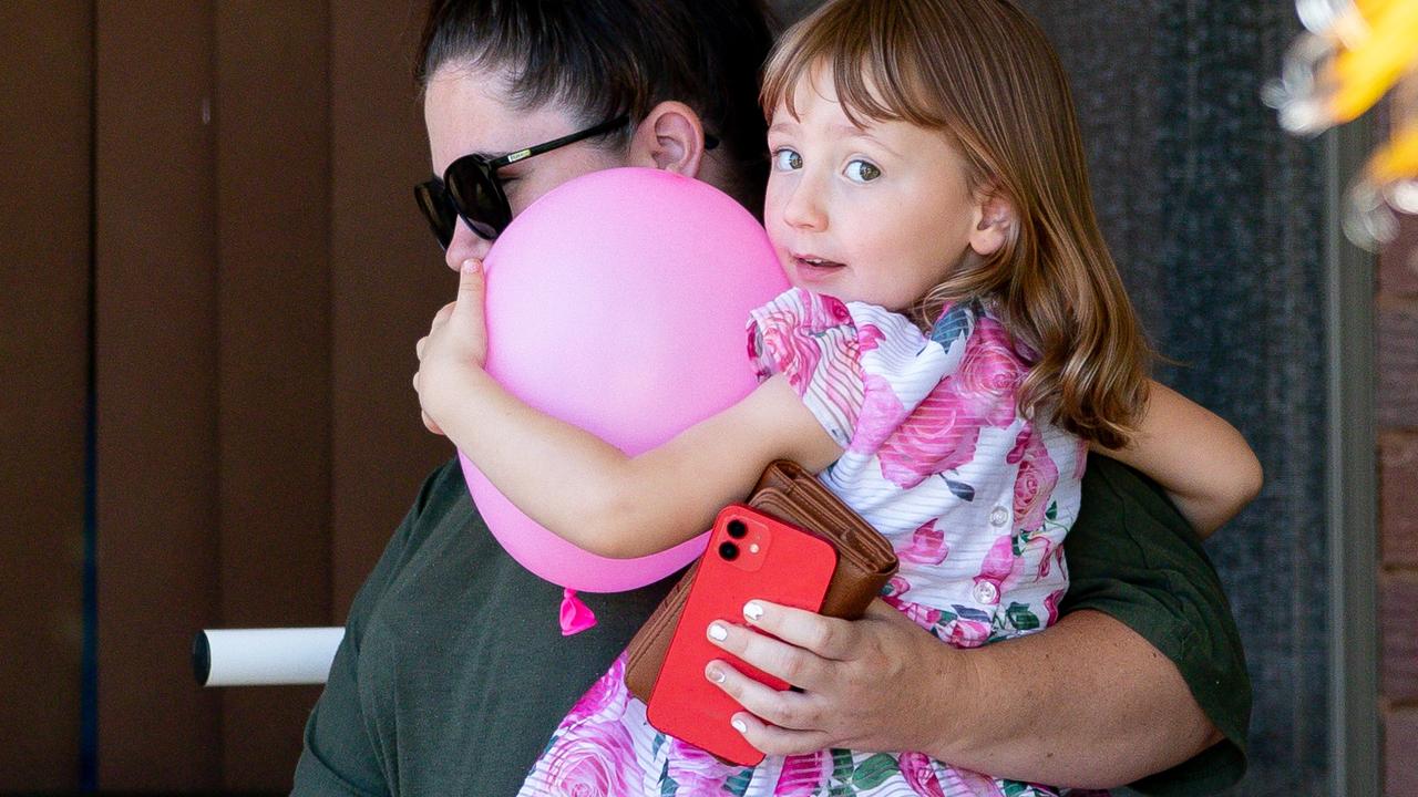 Cleo pictured in her mum Ellie’s arms, leaving the house where she spent her first night after being rescued. Picture: Richard Wainwright/AAP