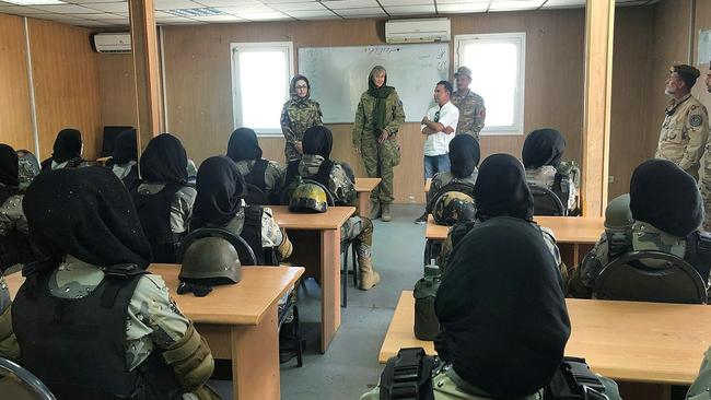 A DIFFERENT TIME: Australian Army officer Captain Anne Andrews speaks with members of the Afghan National Police in Kabul Afghanistan in August 2019 while deployed on Operation Highroad. Picture: Department of Defence