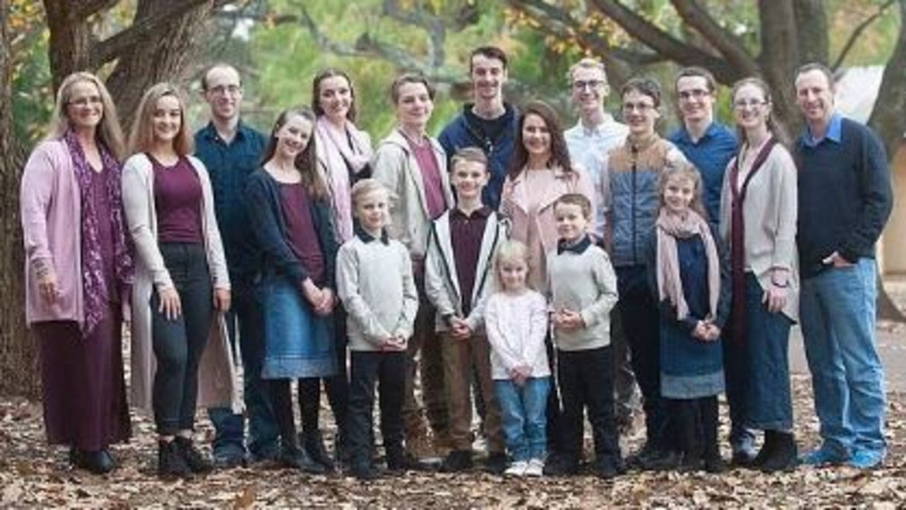 Jeni Bonell (far left) and husband Ray (far right) with their 16 children who are aged between six and 31. Picture: Instagram/thebonellfamily