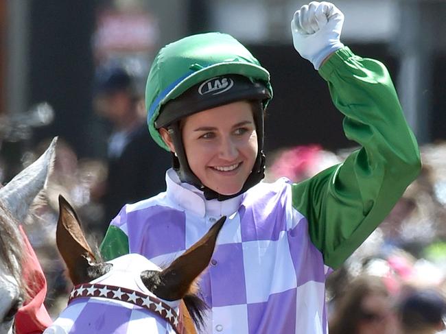 (FILES) A file photo taken on November 3, 2015, shows jockey Michelle Payne celebrating after becoming the first female jockey to win the Melbourne Cup, in Melbourne. Melbourne Cup-winning jockey Michelle Payne is undergoing tests in hospital after falling during a race and complaining of acute abdominal pain, sparking fears of internal injuries, racing officials said May 24, 2016. Australia's Payne -- the first woman to win the 155-year-old Melbourne Cup last year -- tumbled from her horse Dutch Courage at Mildura in northwest Victoria state on Monday and was taken to a nearby hospital. / AFP PHOTO / PAUL CROCK / IMAGE RESTRICTED TO EDITORIAL USE - STRICTLY NO COMMERCIAL USE