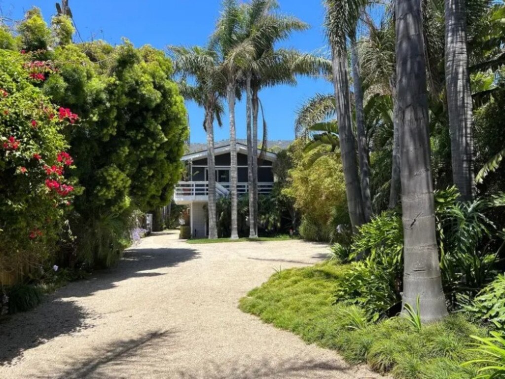 The entrance is tucked away off a beachside road. Picture: Realtor/Berkshire Hathaway