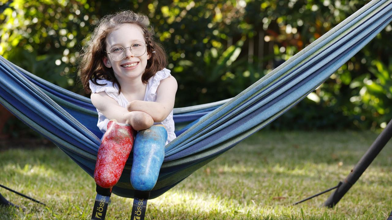 Brisbane’s Mia Wilkinson, 9, now lives as a quadruple amputee following a fight with sepsis which developed from a dose of the flu. Picture Lachie Millard