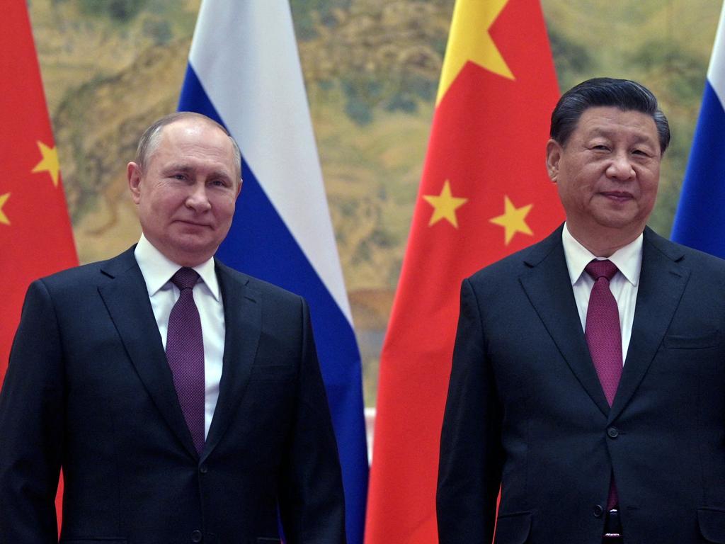 Russian President Vladimir Putin (L) and Chinese President Xi Jinping...the new cyber security task force will counter Russian and Chinese cyber threats.