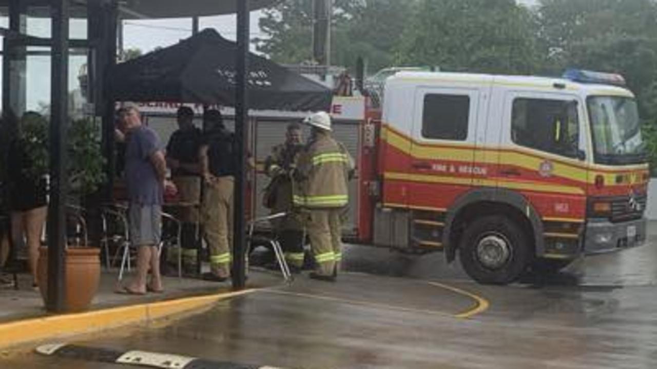 Gympie fire fighters finish testing the air inside Toucan Coffee for any toxic fumes after fire broke out in a coffee machine on Tuesday.