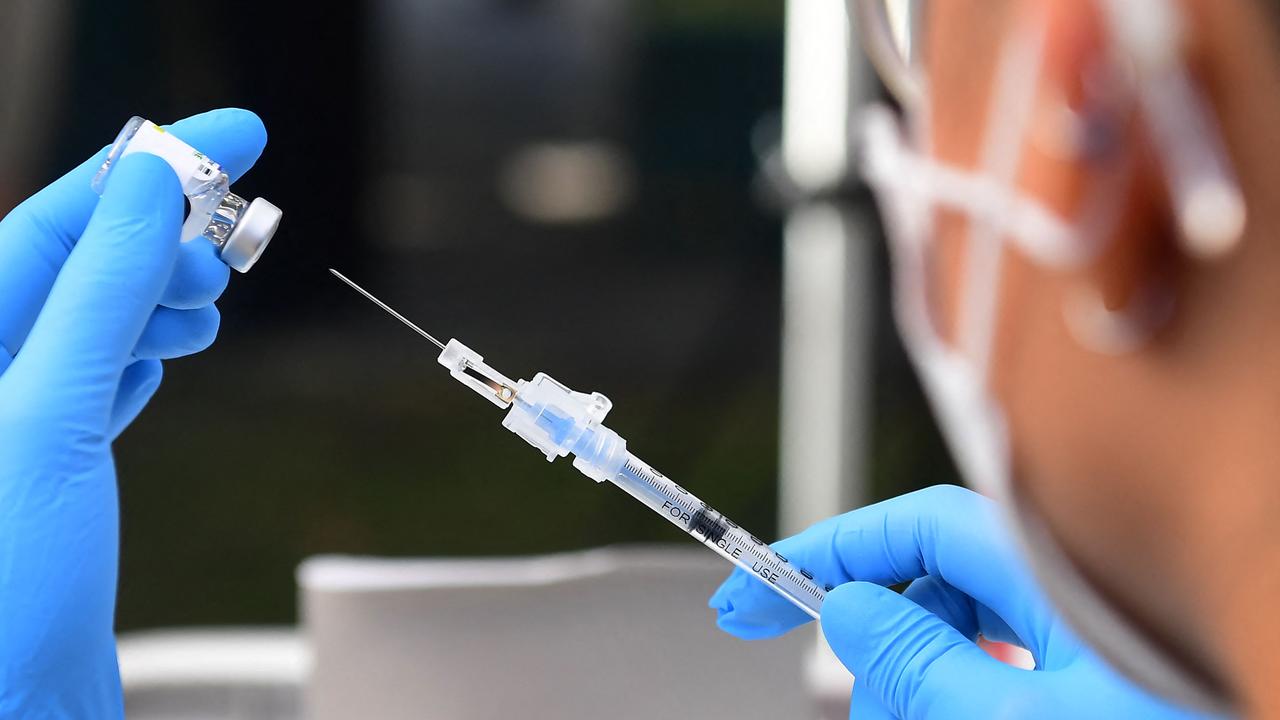 Qld currently has more than 61 per cent of eligible residents with a first dose and 42 per cent are fully vaccinated. Photo by Frederic J. Brown / AFP.