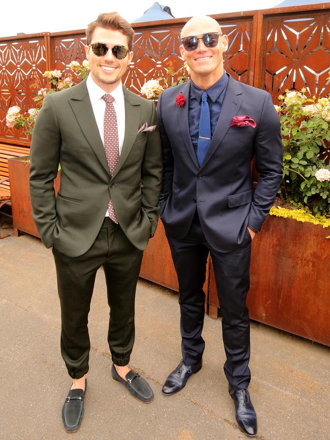 Jason Dundas and Michael Klim show off their outfits. Photo: Stuart McEvoy