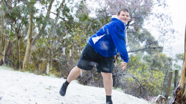 Riley Direen playing in the snow in Berriedale where roads became impassable on Tuesday afternoon. Picture: Richard Jupe