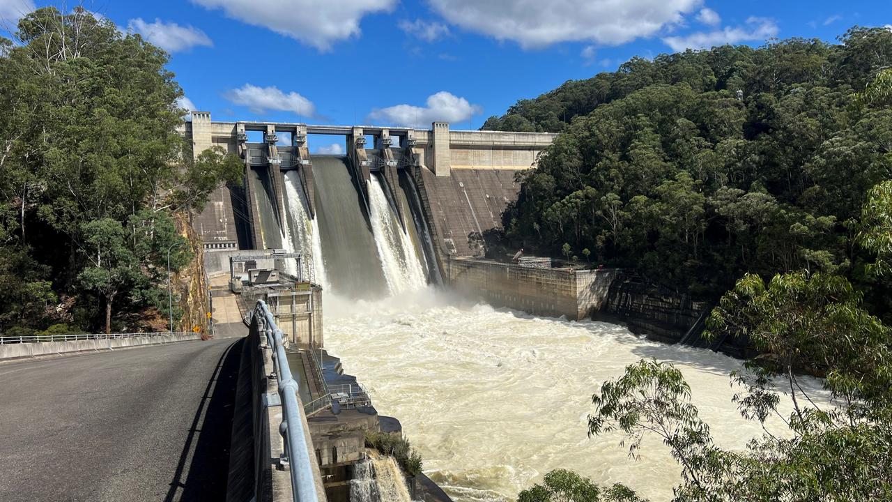 Warning as major dam spills