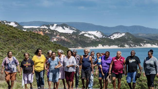 Members of Hope Vale’s Guugu Yimithirr Indigenous clan gather on their ancestral land near the site of a proposesd silica mine.Picture: Brian Cassey