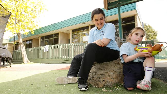 Coburg Special and Developmental School students Marrium and Madeline in the school’s play area. Picture Norm Oorloff