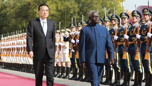 Chinese Premier Li Keqiang holds a welcoming ceremony for Solomon Islands' Prime Minister Manasseh Sogavare in Beijing in 2019.