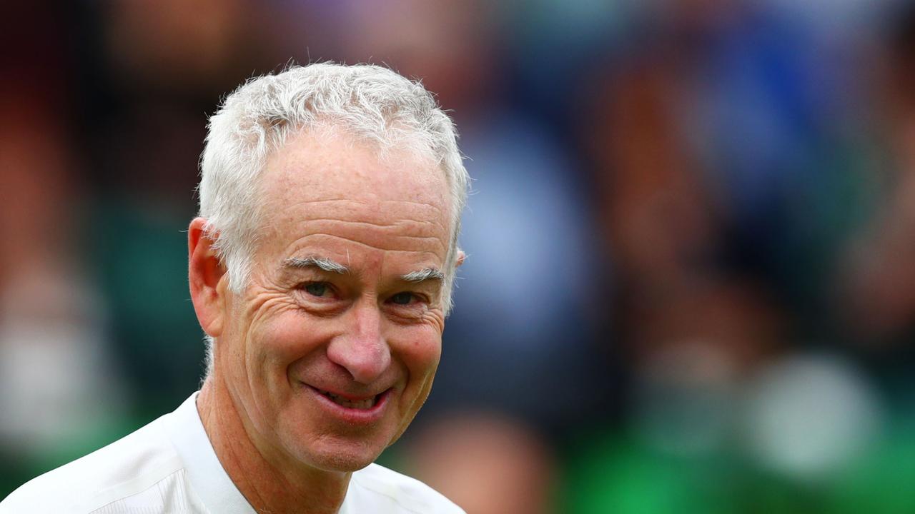 John McEnroe smiles during a mixed doubles match in support of the Wimbledon Foundation. (Photo by Dan Istitene/Getty Images)