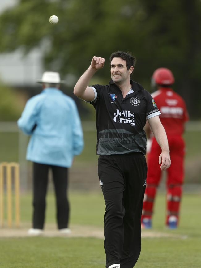 James Pearson takes the ball at the top of his delivery stride. Picture: Valeriu Campan