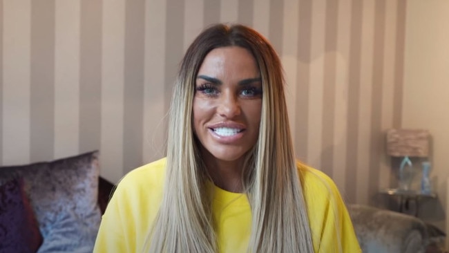 Katie Price shows off her new teeth.