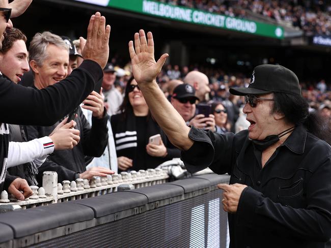 Carlton Blues fan Gene Simmons presents the match-day ball for the clash against the Collingwood Magpies at the MCG. Picture: Michael Klein