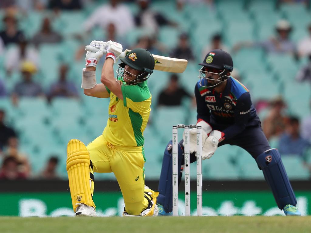 Australia's David Warner hits a six during the One-Day International cricket match between Australia and India at the SCG. Picture: Brett Costello