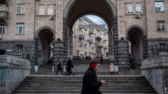 People walk in Kyiv, Ukraine on Friday as the White House warns Russia could invade Ukraine within a week. Picture: Chris McGrath/Getty Images