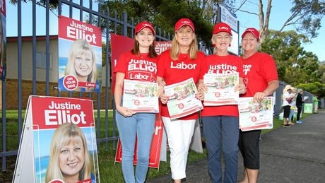 Richmond MP Justine Elliot and her family hand out How to Vote cards at Centaur Primary School.