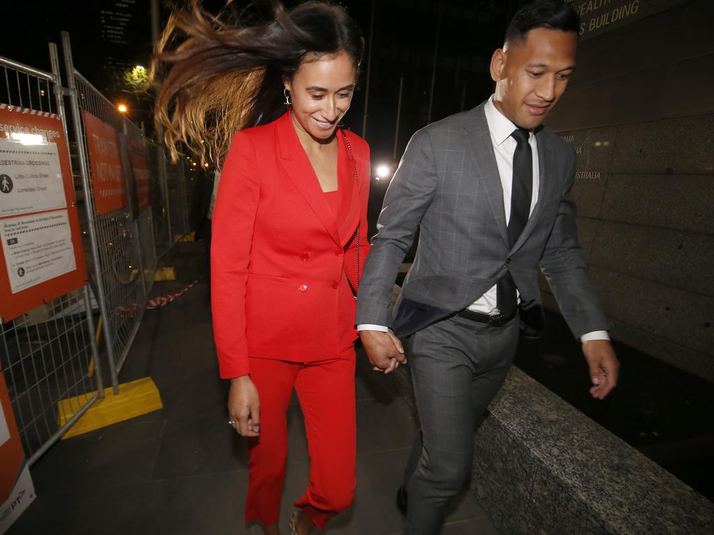 Maria Folau holds hands with husband Israel as he leaves Federal Court on December 02, 2019 in Melbourne, Australia. Folau met with Rugby Australia to begin mediation talks surrounding his dismissal from his Rugby Australia contract for player code breaches. Picture: Darrian Traynor