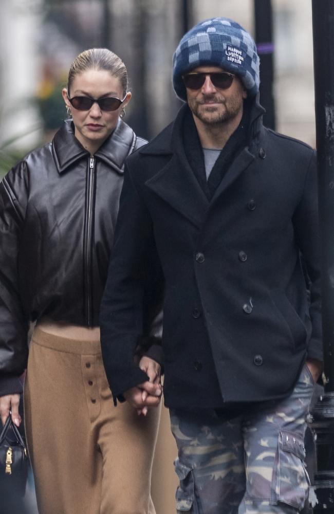 They held hands as they strolled down the street. Picture: GoffPhotos.com