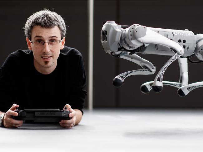 James Walsh with Clive the robotic dog at Uni SA on May 17, 2022 in Mawson Lakes. Picture Matt Turner.