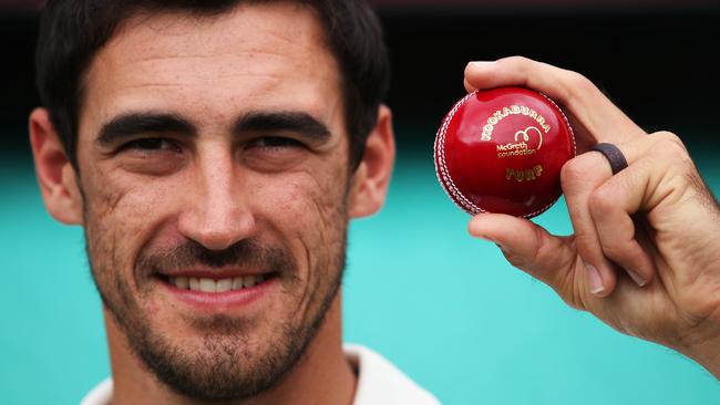 Australia's Mitchell Starc with a kookaburra ball being remarked with the McGrath Foundation ahead of the SCG Test match. Picture. Phil Hillyard