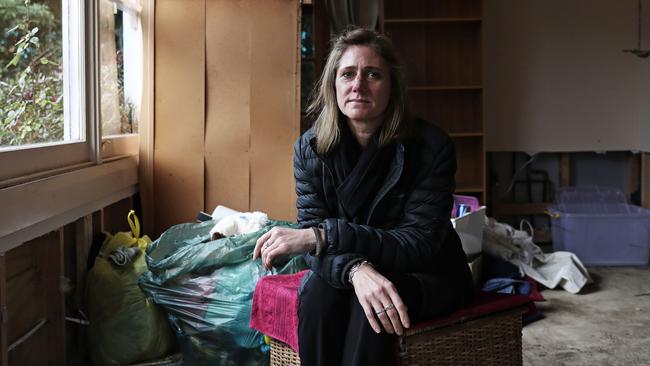 Suzy Browne in her South Hobart home that she still cannot live in that was seriously damaged in the floods. Picture: LUKE BOWDEN