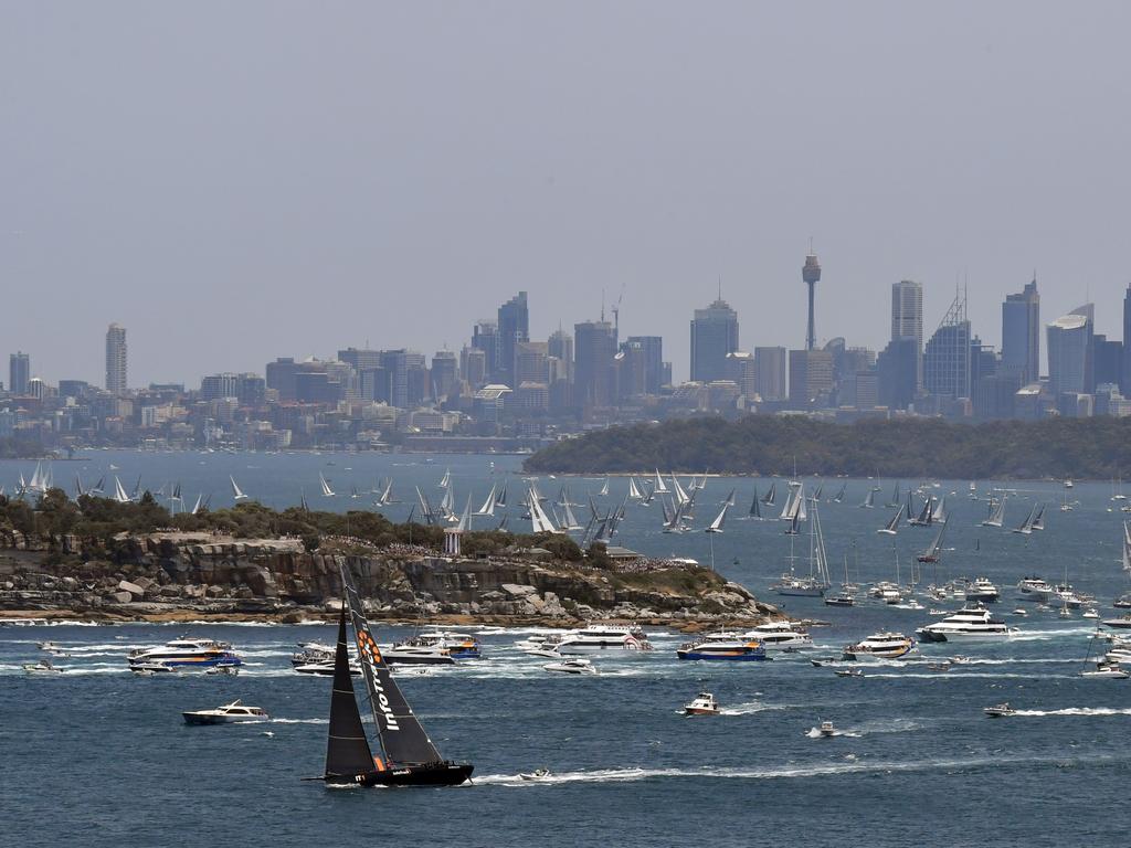 InfoTrack leads the fleet at the start of the Sydney to Hobart Yacht race, seen from North Head in Sydney, Thursday, December 26, 2019. (AAP Image/Mick Tsikas)