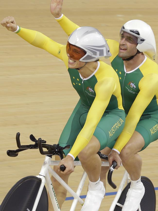 Scott McPhee and Kieran Modra celebrate after winning the gold medal in the Men’s Individual B Pursuit at the 2012 Paralympics games. Picture: AP Photo/Alastair Grant