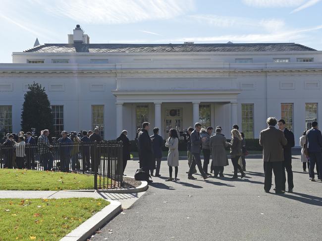 A crowd gathers outside the West Wing of the White House in Washington as they wait for the arrival of President-elect Donald Trump for his meeting with President Barack Obama. Picture: AP Photo/Susan Walsh