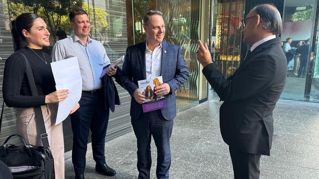 Bachelor reality TV contestant Marg Irving, formerly Zogoulas, left, pictured here meeting Brisbane Lord Mayor Adrian Schrinner, shared fingerprint access to Mr Khan’s office, a company insider says.