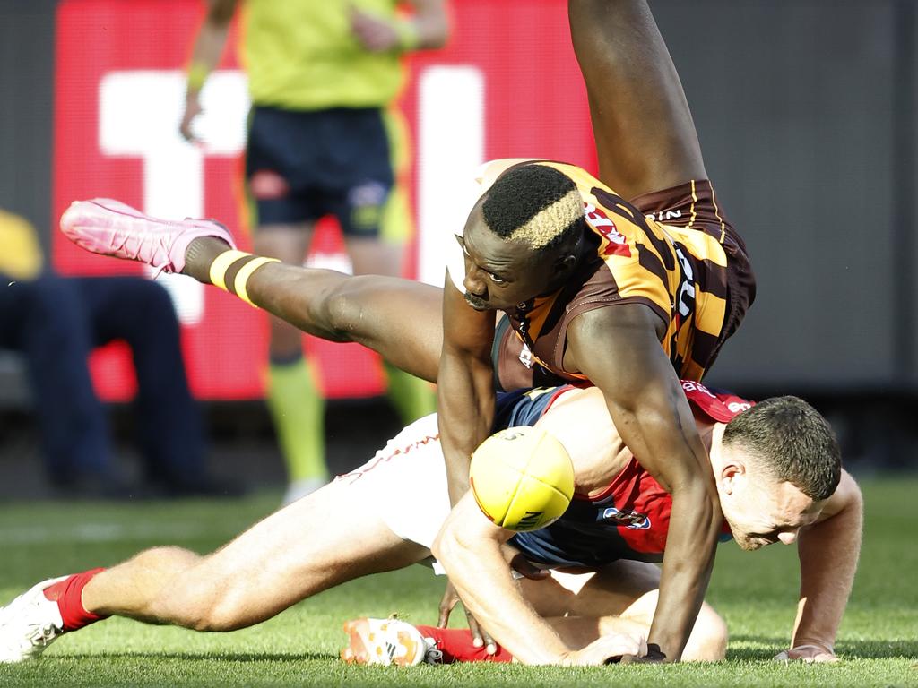 Mabior Chol lands on Steven May on the wing at the MCG. Picture: Darrian Traynor/Getty Images.