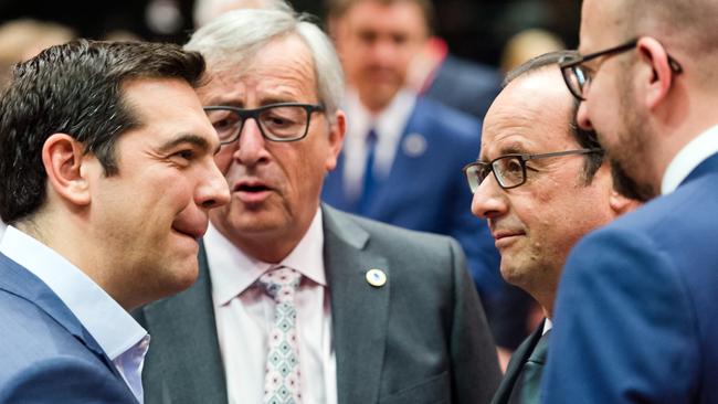 Greek Prime Minister Alexis Tsipras speaks with European Commission President Jean-Claude Juncker, French President Francois Hollande and Belgian Prime Minister Charles Michel.