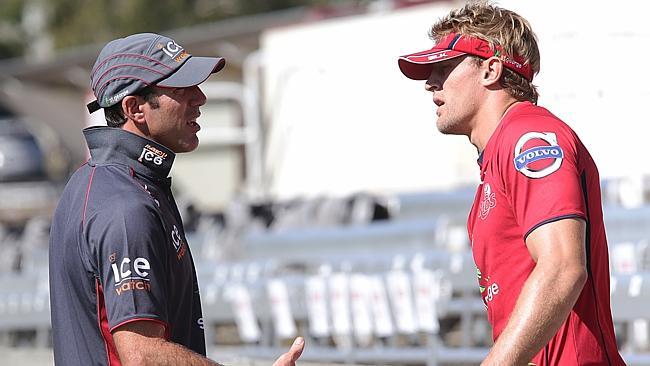 Red coach Richard speaks to Lachie Turner, ho is currently injurd, at a training session at Ballymore.