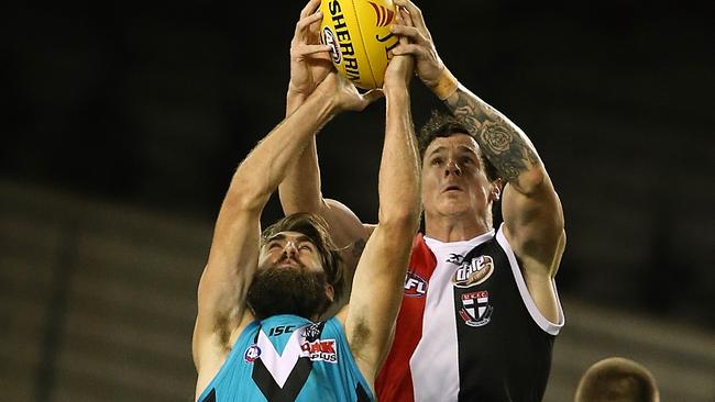 Port Adelaide’s Justin Westhoff marks in front of Jake Carlisle. Will resume hostilities in China next year. Picture: Wayne Ludbey