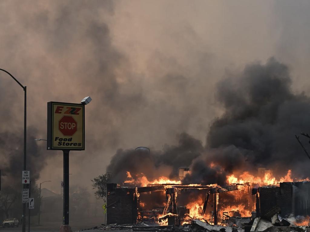 AFTER: A food store burns during the Eaton Fire in Altadena, California, on January 8, 2025. AFP via Getty Images