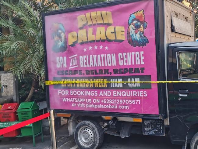 A promotional vehicle advertises the Pink Palace Spa &amp; Relaxation centre.