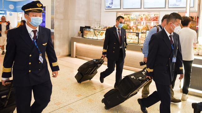 Pilots believed to have flown the flight MU749 from Wuhan China arriving in Sydney Airport on Thursday. Picture: Flavio Brancaleone