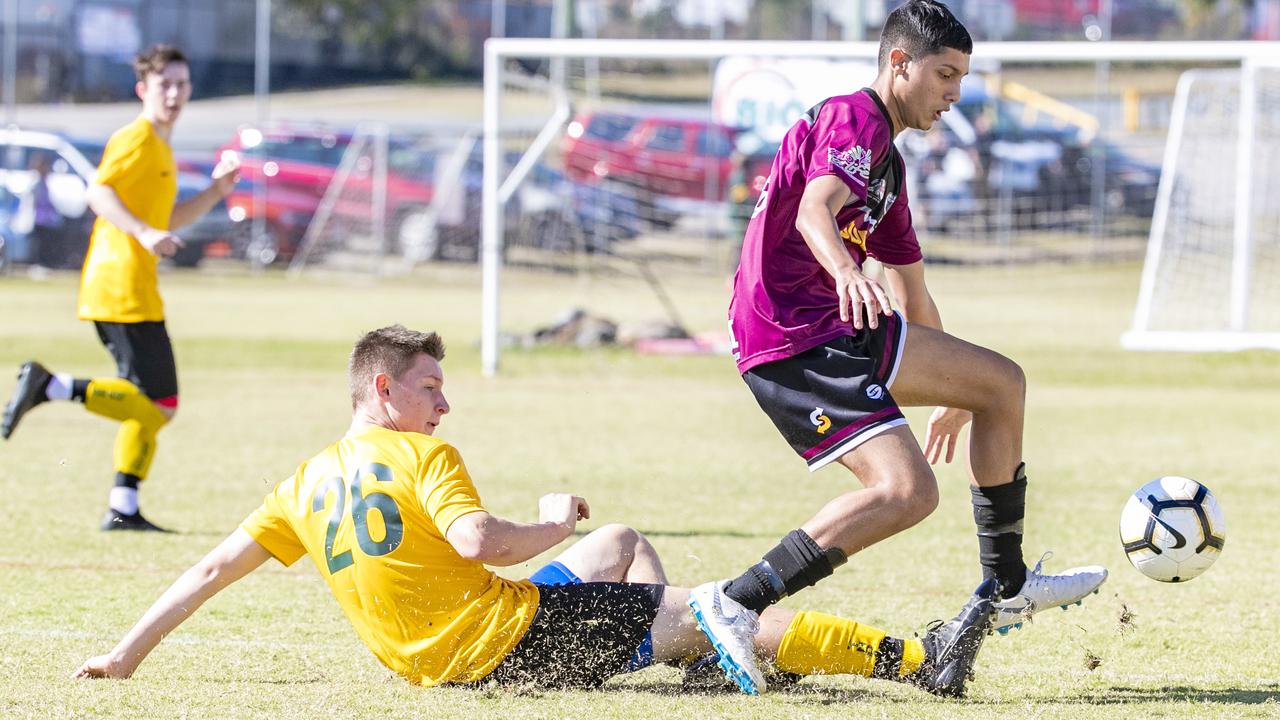 Lachlan Suitor and Usmann Ali in the Queensland Schools Premier League Football. Picture: Richard Walker