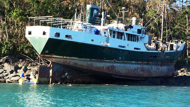 Former Australian Navy ship the MV Banks was stuck on Whitsunday Island.