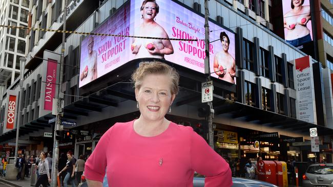 Lindsey Kennedy, one of the faces of the campaign, outside a billboard in Melbourne. Picture: Tony Gough